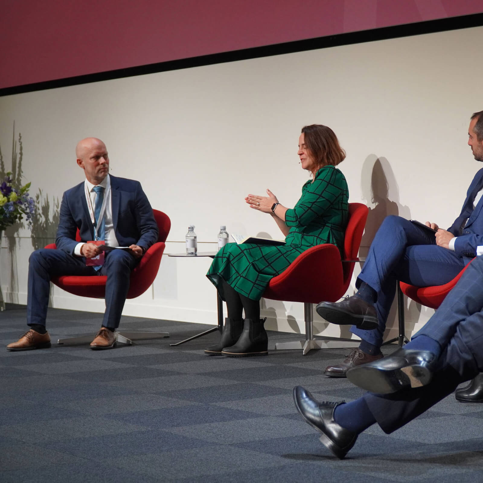 Panelists seating in conversation